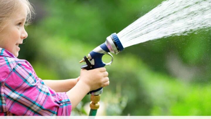 text "best lightweight garden hoses" at the bottom of an image of a young girl in a pink shirt spraying water into the air with a garden hose