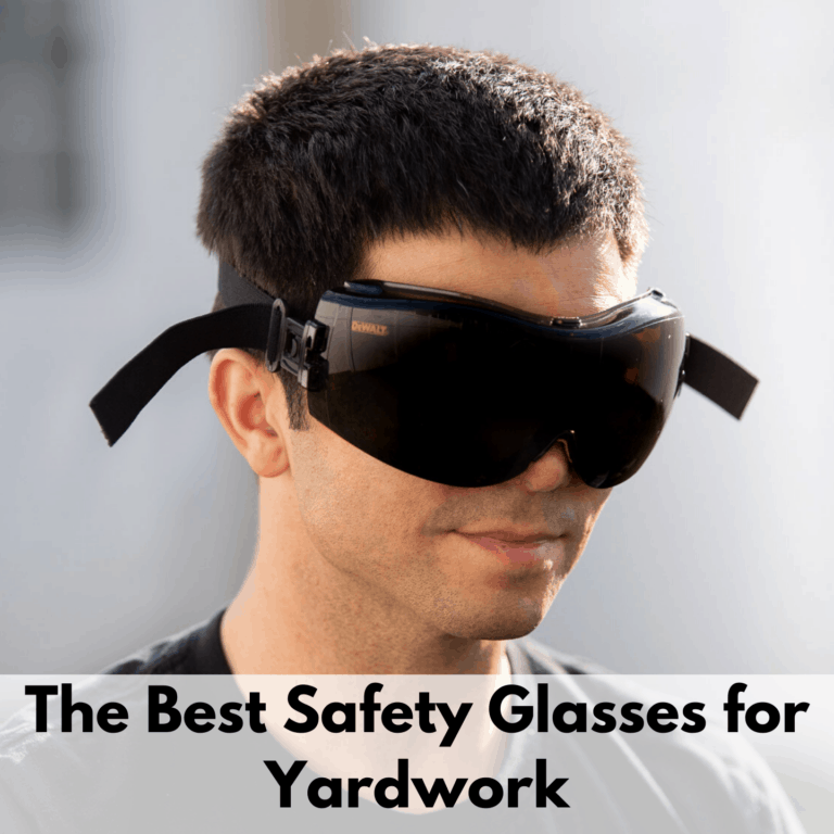Text reads, "The best safety glasses for yardwork." Text is on a white transparent text box at the bottom of the image. The photo above is of a man wearing the DeWalt tinted safety goggles. The background is primarily white but is out of focus.