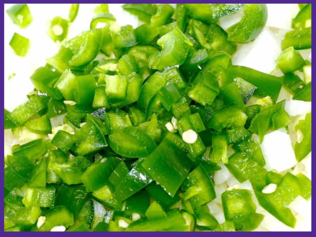 A close up of diced green jalapeño peppers