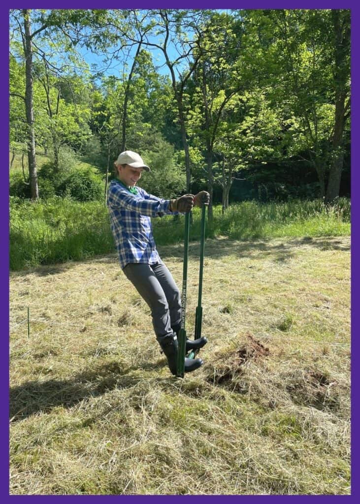 A woman in a blue plaid shirt using a meadow creature broadfork