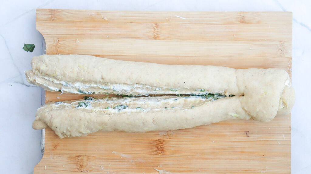 a roll of dough that has been cut for braiding