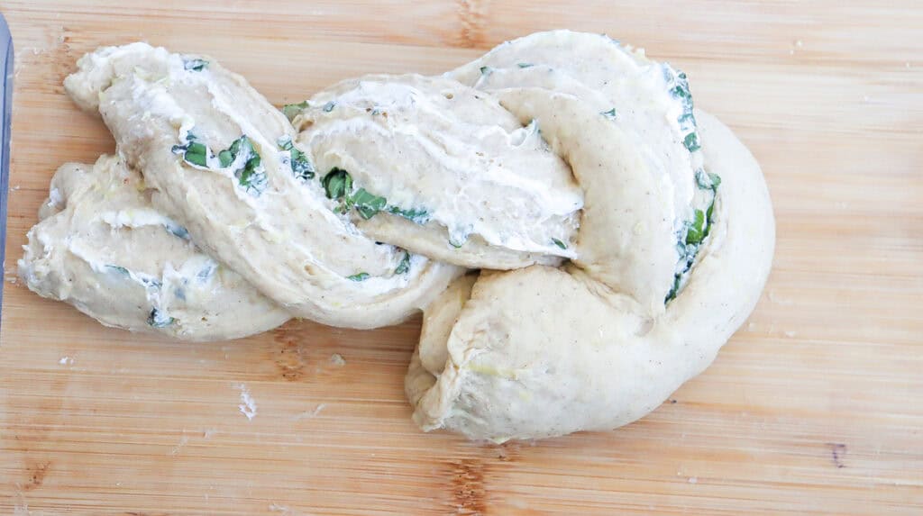 braiding a load of zucchini bread