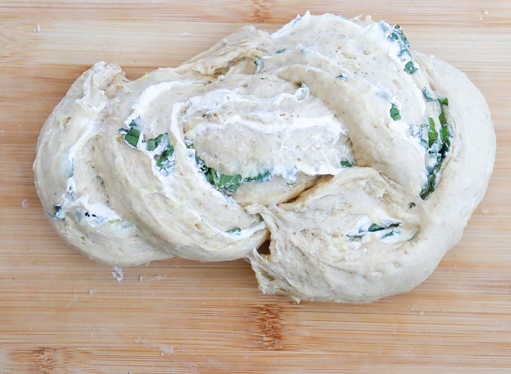 tucking the ends under on a loaf of braided bread