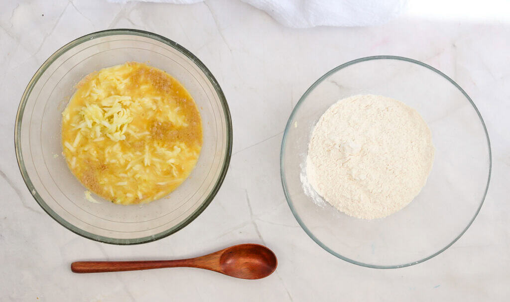 mixing zucchini into an egg and milk mixture