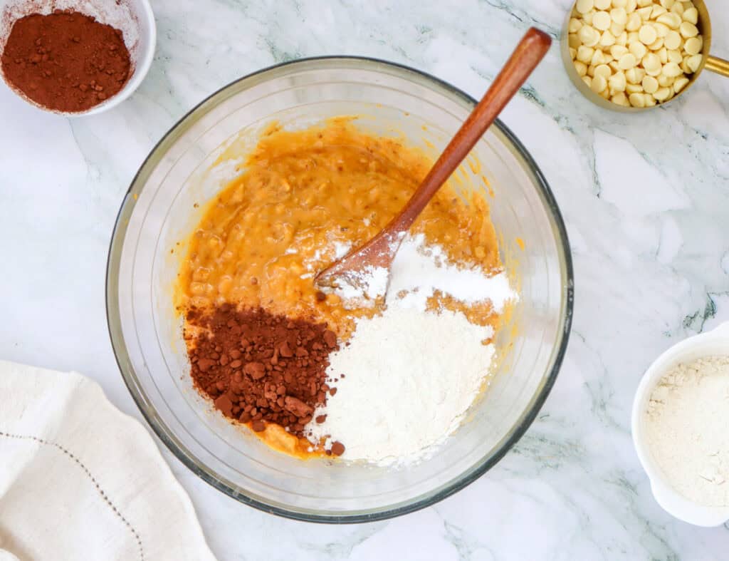 adding in dry ingredients for sweet potato brownies