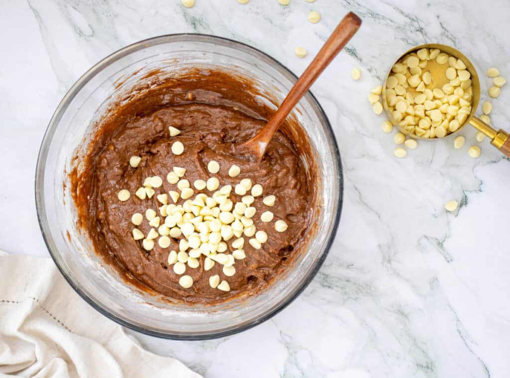 folding in chocoalte chips for sweet potato brownies