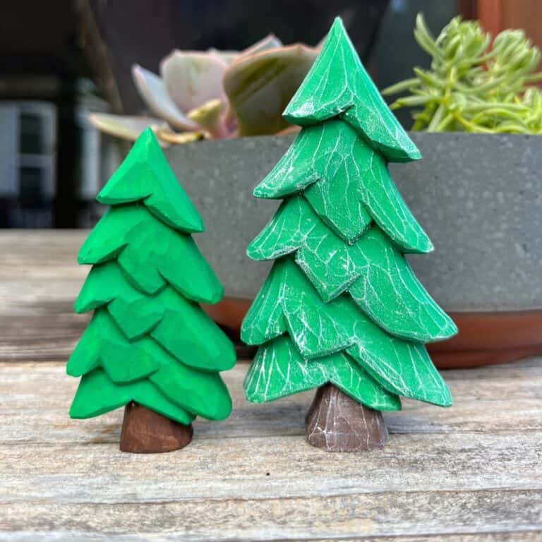 two wood carved christmas trees