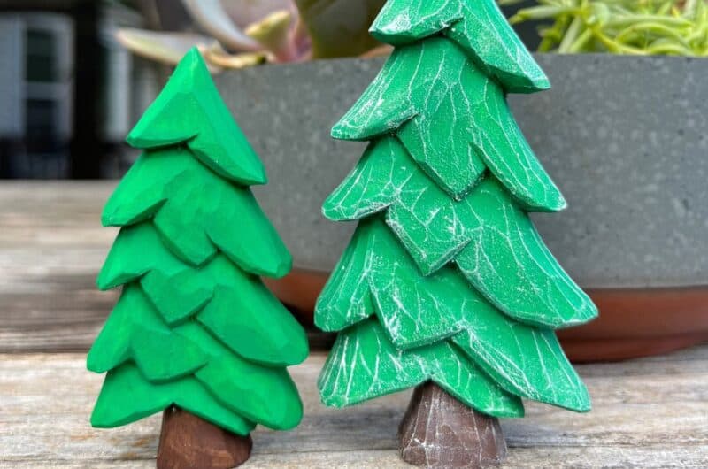 two wood carved christmas trees