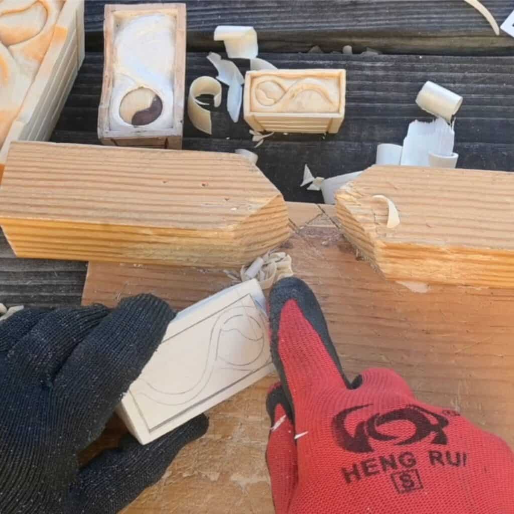 carving a wood baby manger