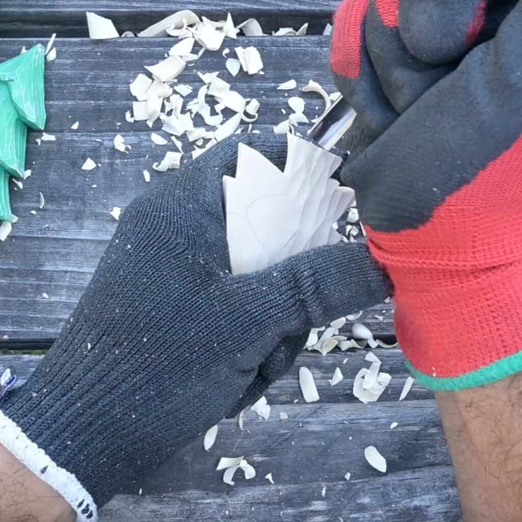 gouging the back of a wood christmas tree carving