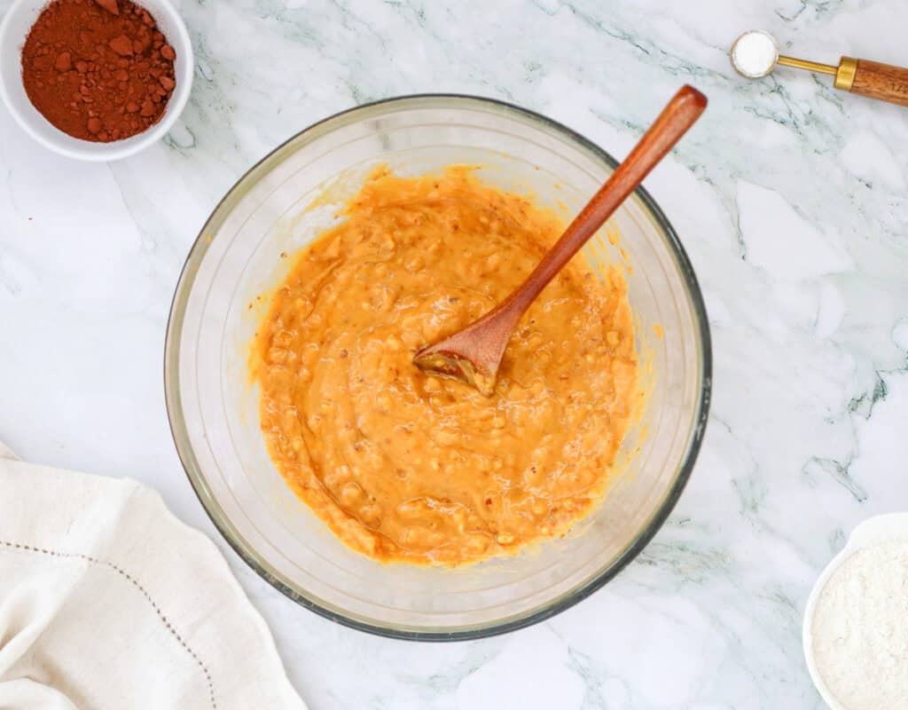 mixing wet ingredients for sweet potato brownies