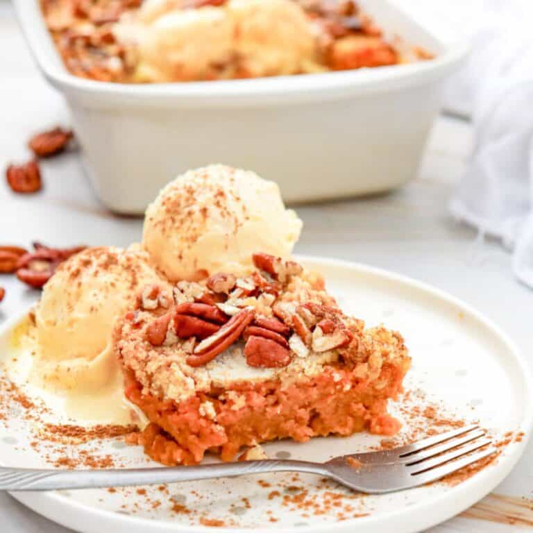 a piece of pumpkin dump cake with ice cream on top