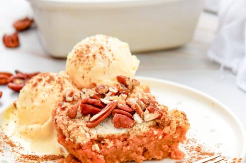 a piece of pumpkin dump cake with ice cream on top