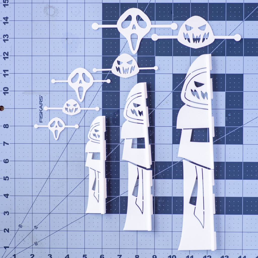 a top down photo of 3d printed stencils on a cutting mat with a grid in inches