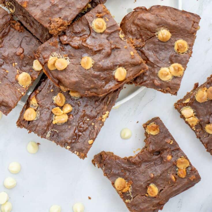 a plate with white chocolate chip brownies made with sweet potato