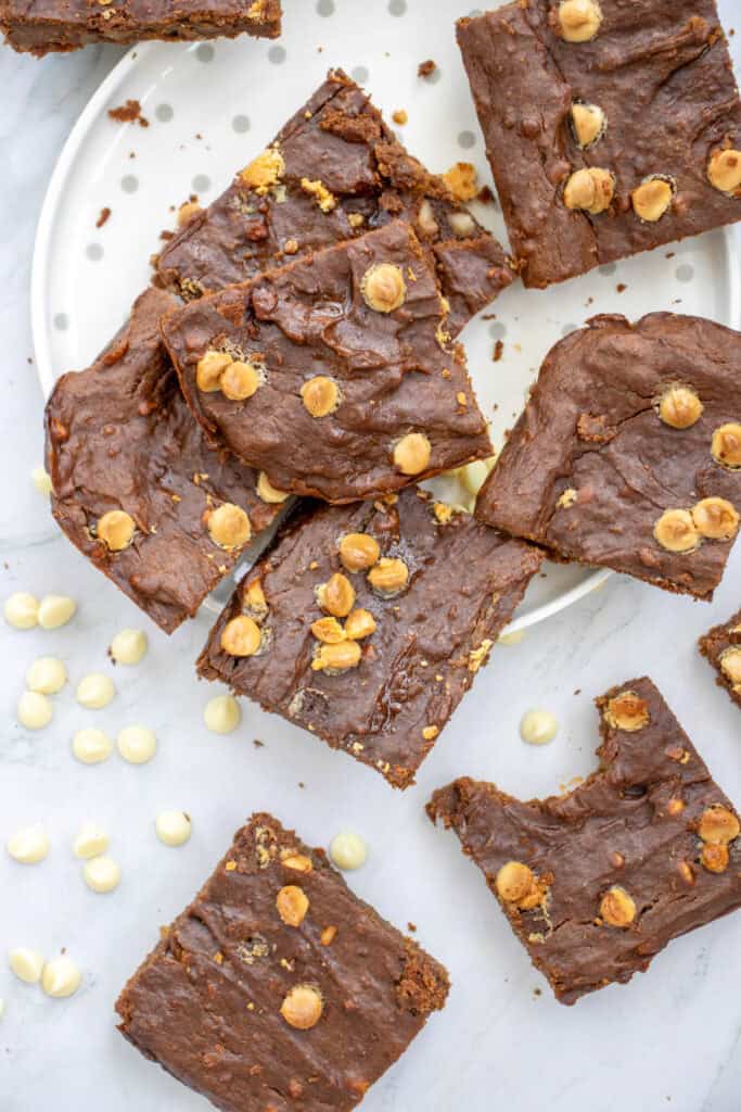 A plate of fudgy brownies made with sweet potatoes, showcasing a dessert that can be categorized as a healthy, guilt-free option among sweet potato dessert recipes.
