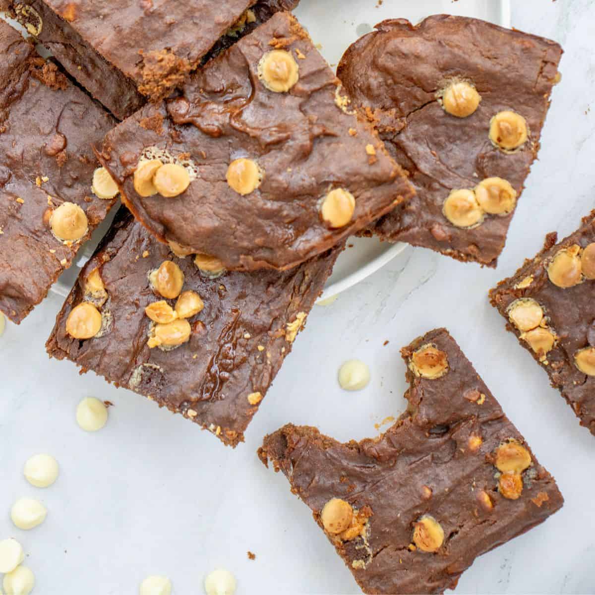 a plate with white chocolate chip brownies made with sweet potato