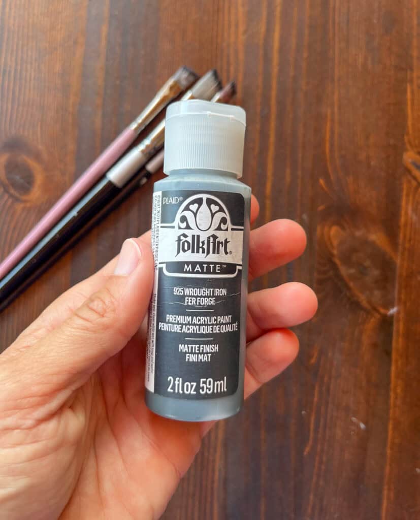 a bottle of folk art craft paint in color "wrought iron"