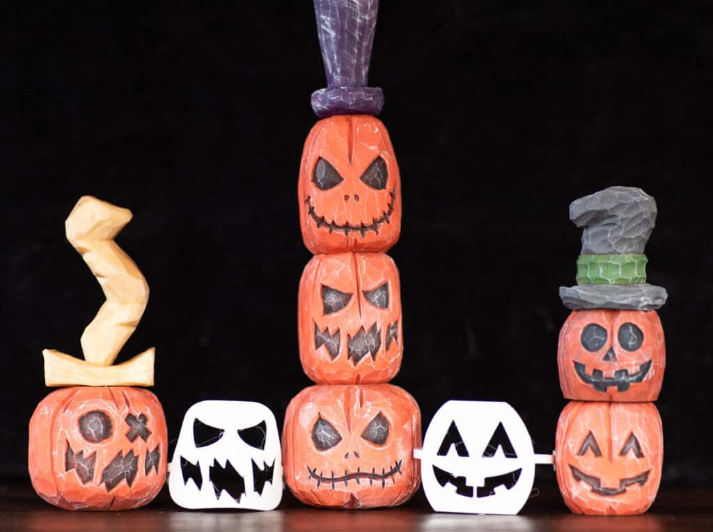 six wood carved pumpkins with flexible face stencils