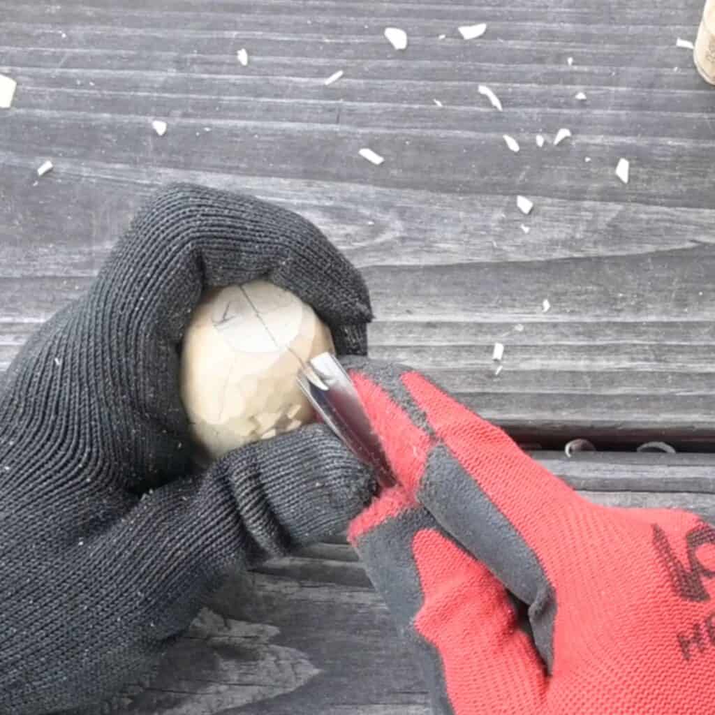 making crevices in a block of wood to carve a pumpkin