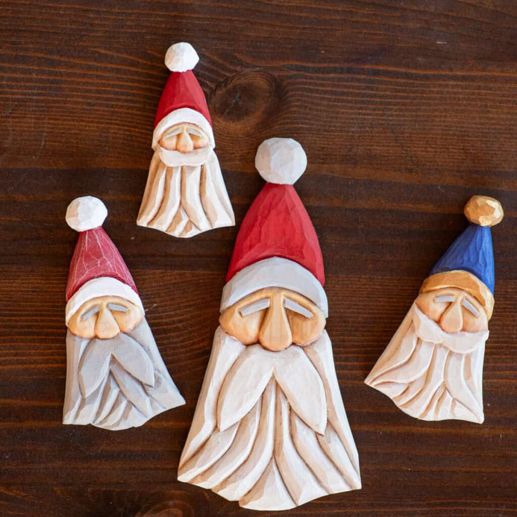 four wood carved Scandinavian inspired wood carvings